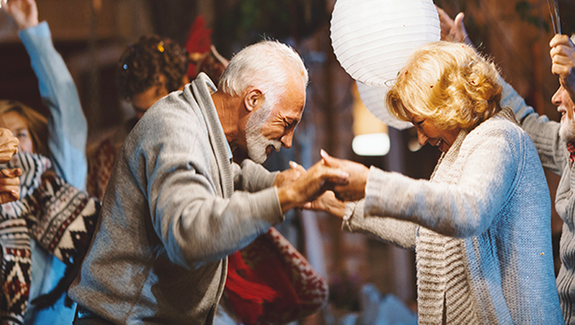 Senior couple dancing at an event