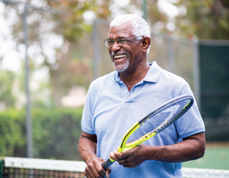 black-senior-playing-tennis