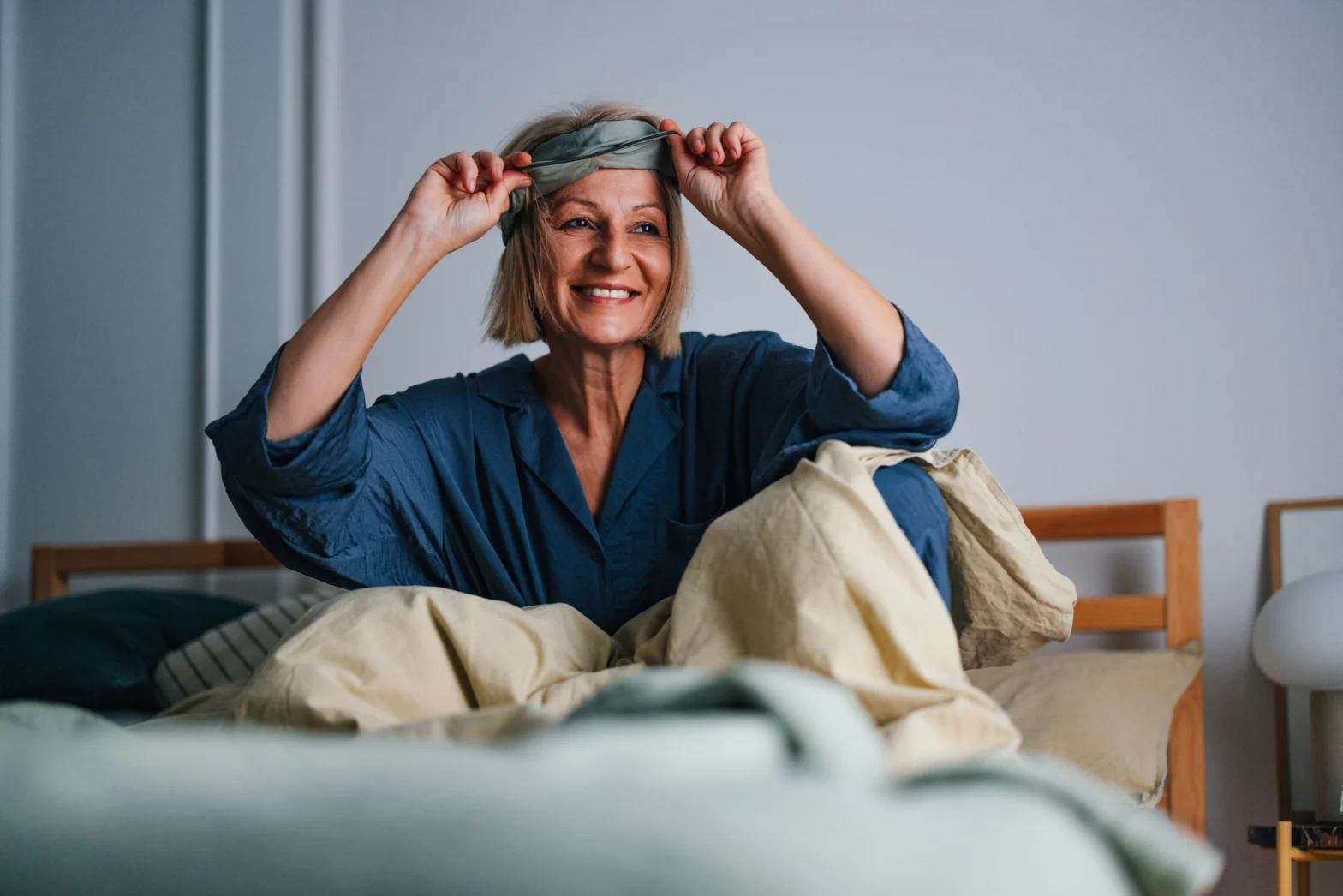 How much sleep do seniors need to wake up happy like this youngish senior woman