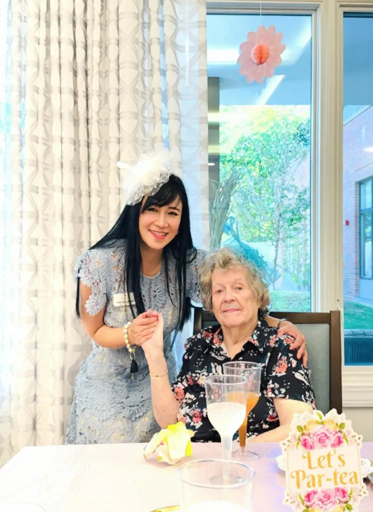 Ann Cardenas with resident at The Delaney at The Vale